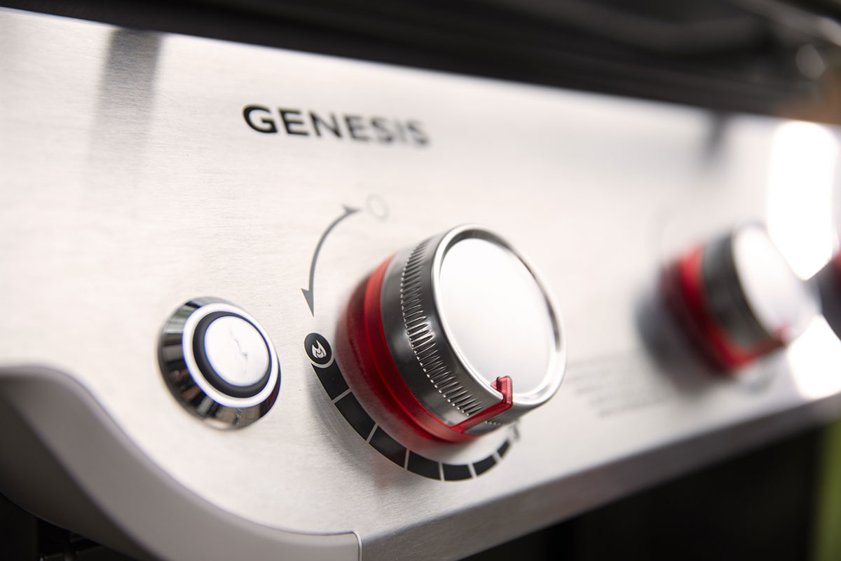 Close-up of power button and a control knob.