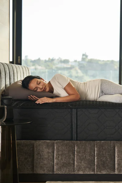 a bedroom set with bed, headboard, sidetable and lamp
