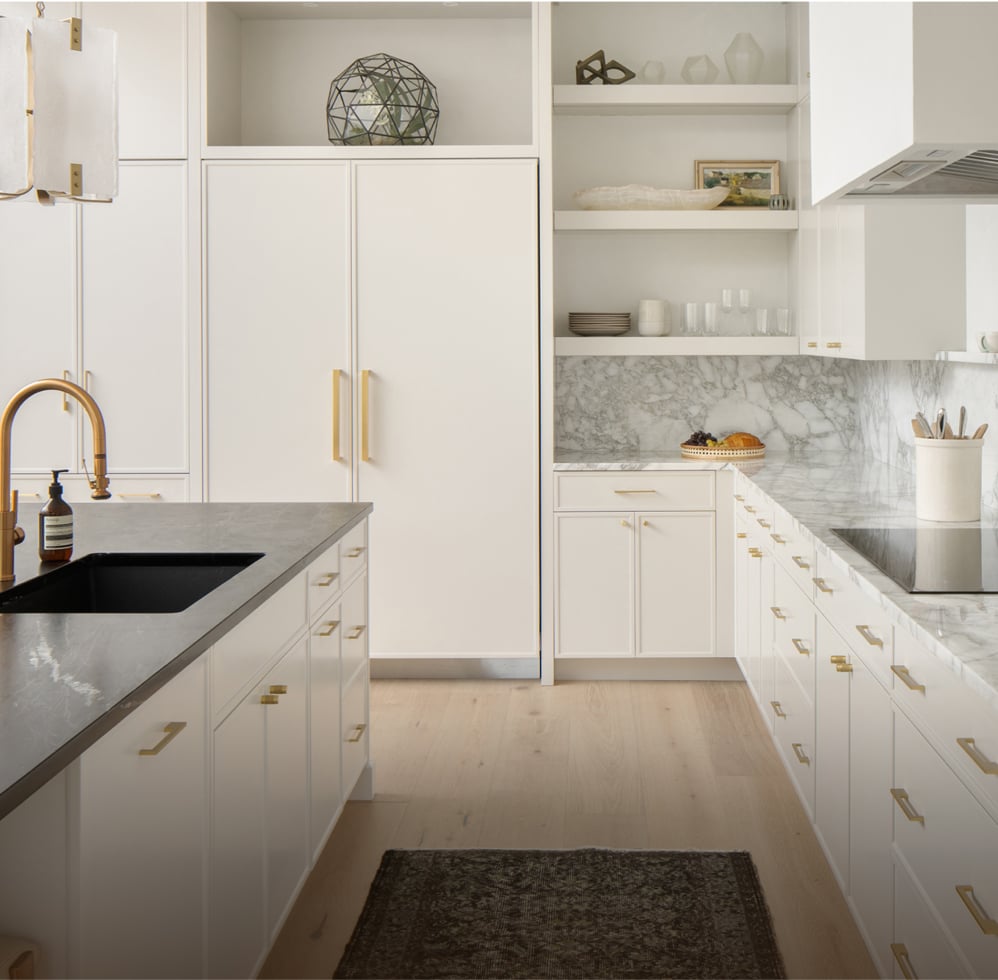 Elegant kitchen featuring white cabinetry, a sleek black sink, and premium Thermador Masterpiece Collection appliances, including a stove, refrigerator, and dishwasher