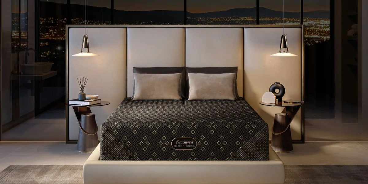A new Beautyrest mattress in a modern bedroom with pillows, modern decor, and glass windows with mountains outside