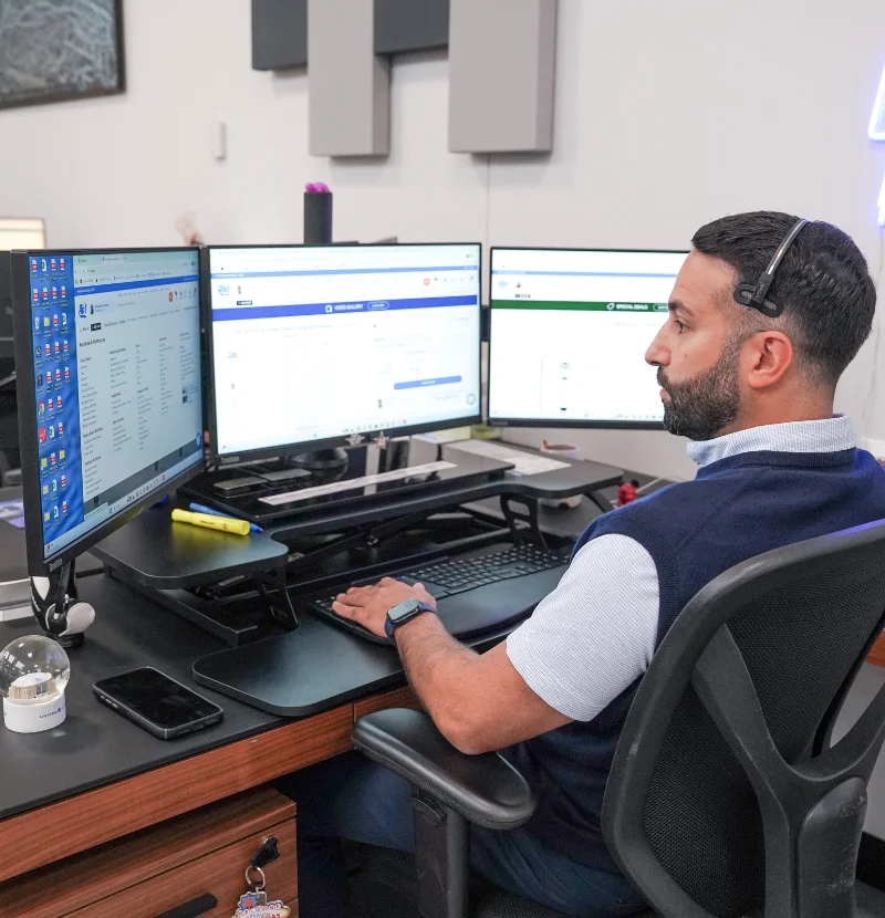 An Abt Builder Division project manager sitting as a desk.