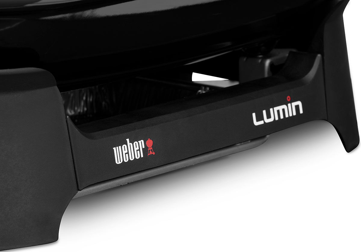 Weber Lumin Logo on a the Grill Base of a  Weber Portable Grill
