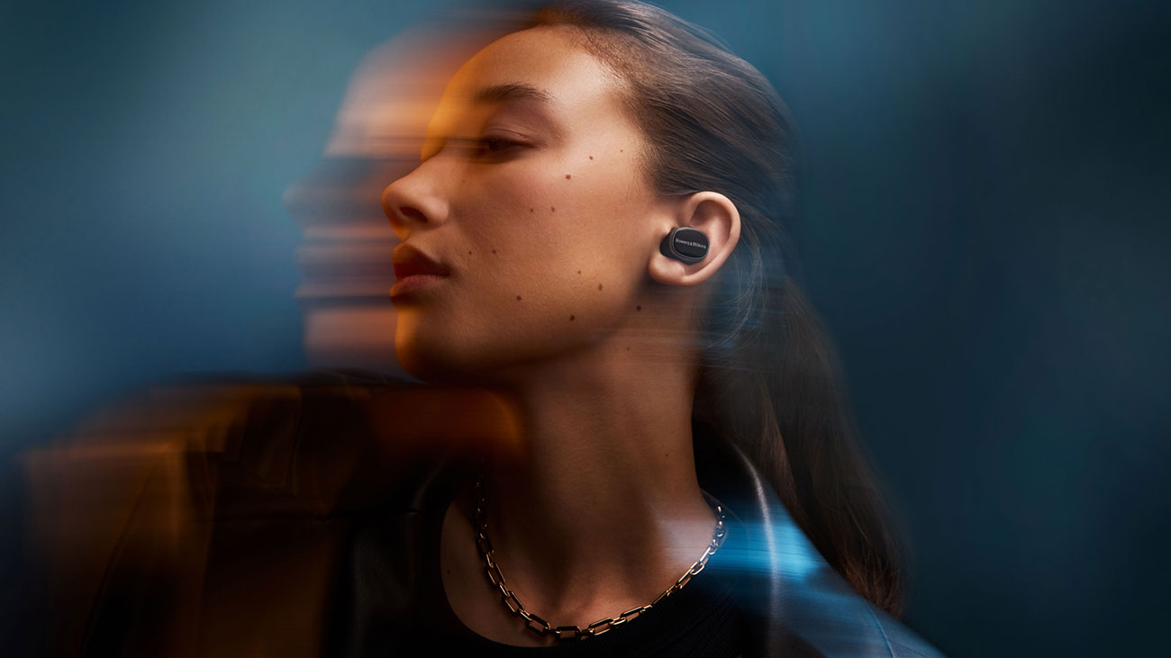 Woman Using Bowers and Wilkins In-Ear Earbuds