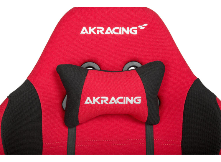 Close-up of chair seat and armrest showing fabric texture and logo AKRACING.