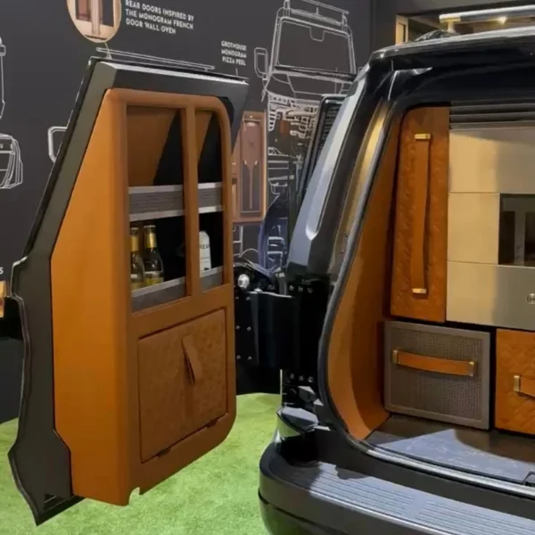 The left trunk door of the Monogram GX car featuring storage for bar tools.