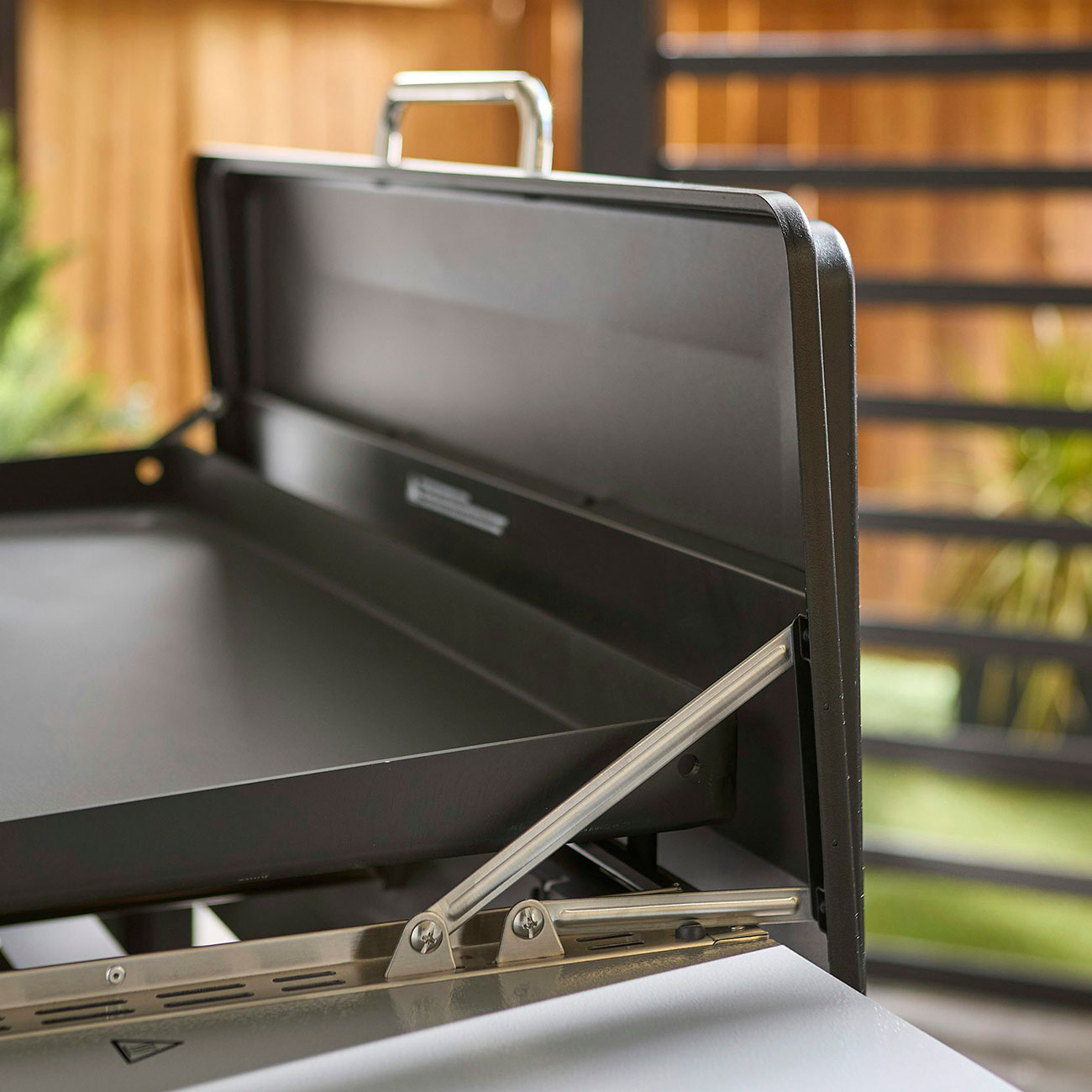 Angled view of Weber Liquid Propane Griddle rails and cover