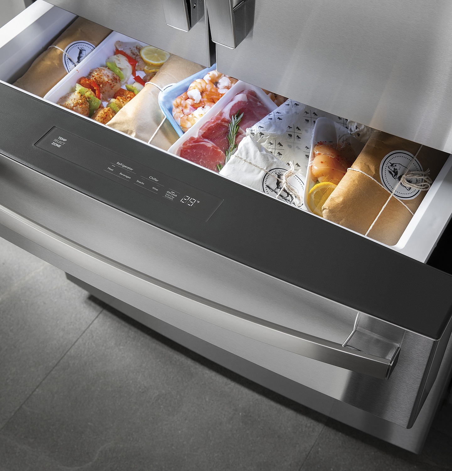 Variety of meats in freezer drawer.