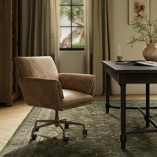 An modern office setting featuring an office chair and a small table, creating a cozy and functional workspace.