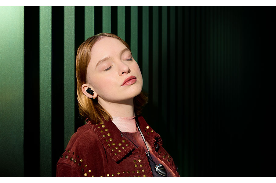 Person Wearing JBL Earbuds