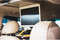 Overhead flip-down screen installed in vehicle's rear seat entertainment system