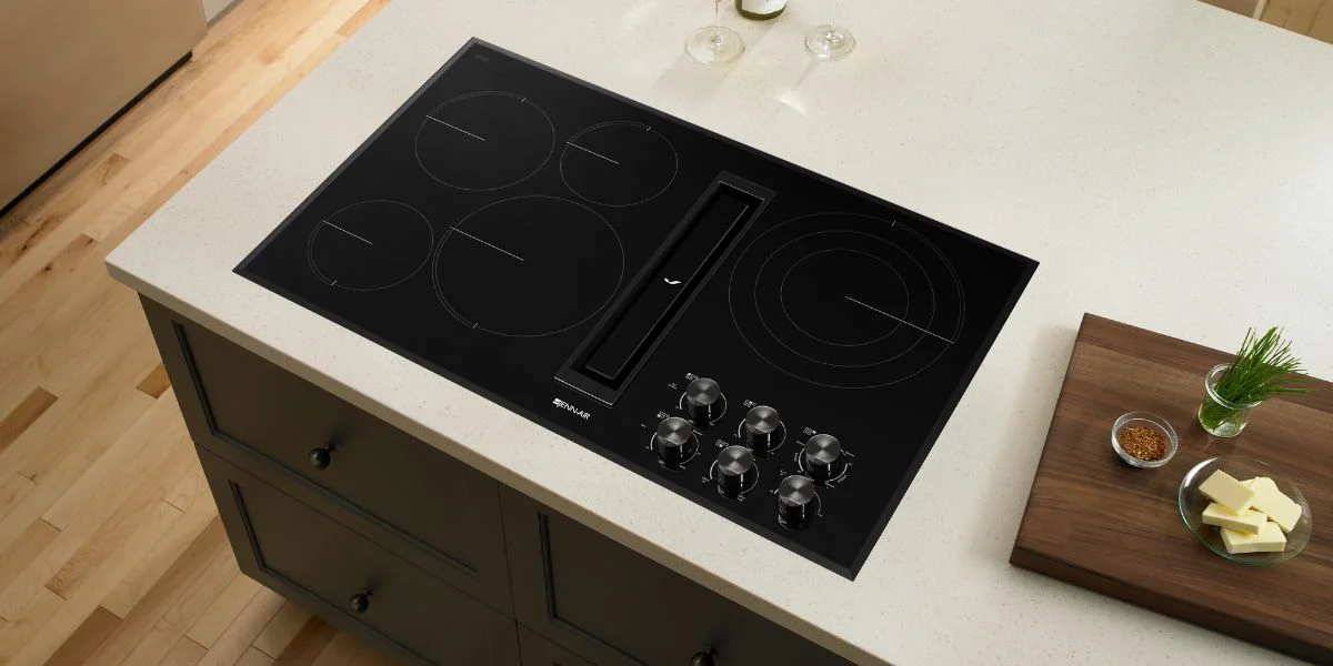 A sleek cooktop with an integrated downdraft.