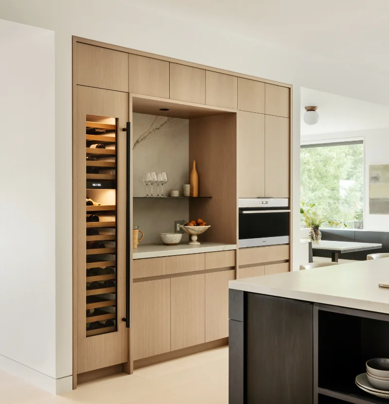 A completed, modern kitchen with stainless steel appliances.