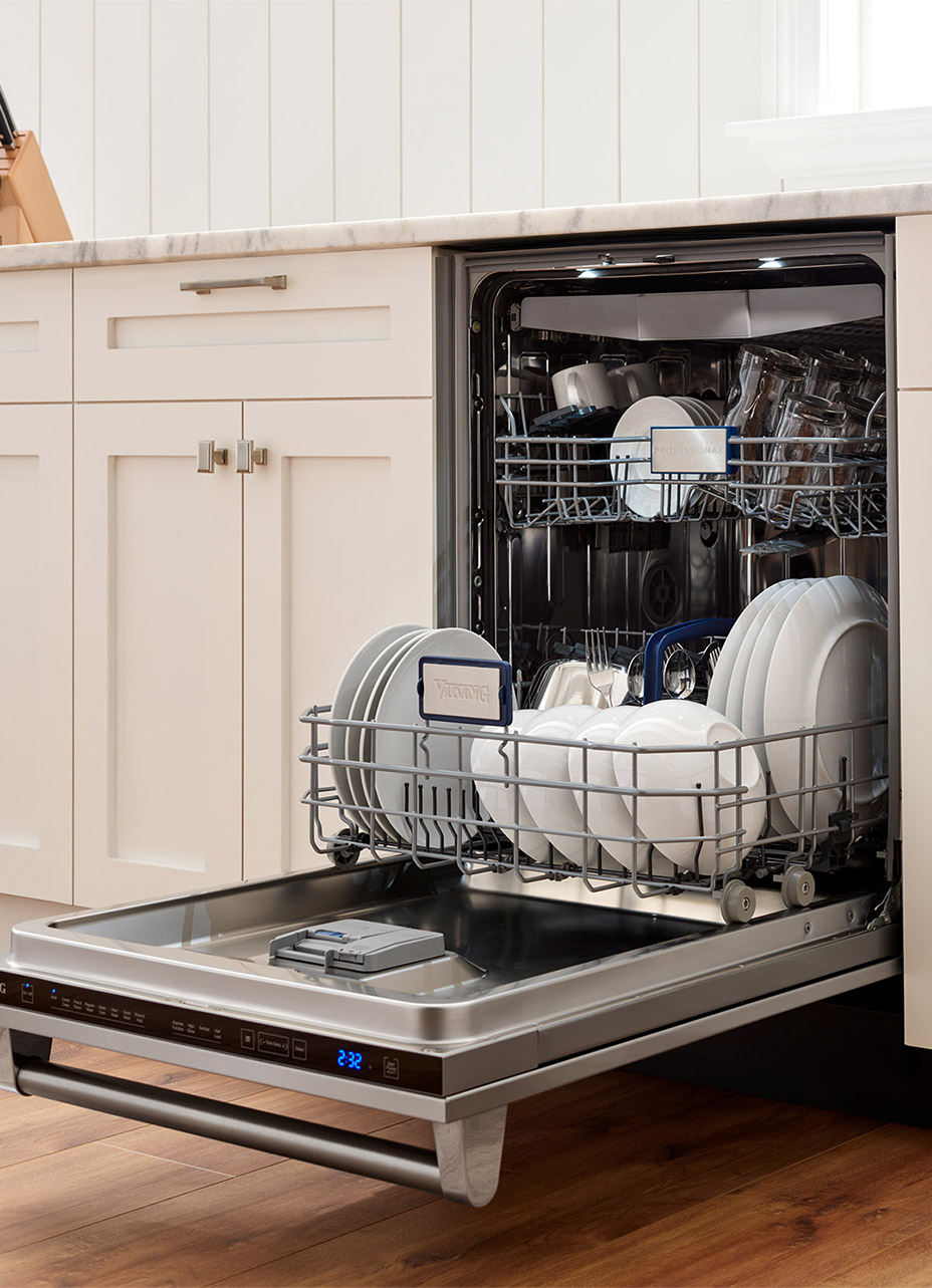 Stylish kitchen showcasing a viking dishwasher with the door open showing the space inside the dishwasher and dishes neatly placed on the bottom and top rack