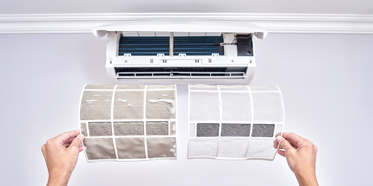 A dirty and a clean air conditioner filter next to each other