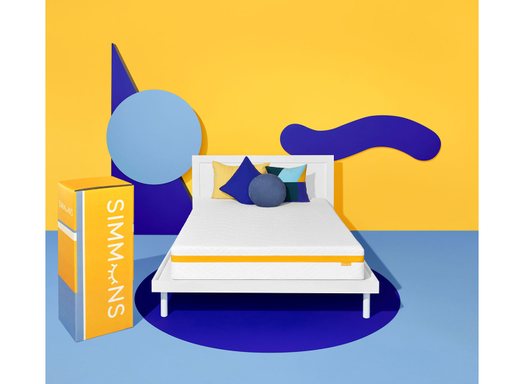 Flat lay shot of a white mattress with orange band, top quilted pattern visible