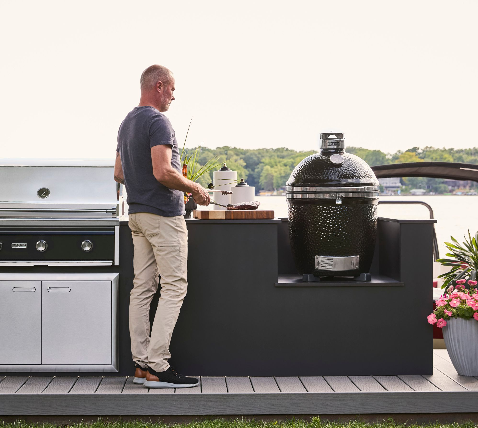 A sedona by lynx grill opened showcasing the large grilling surface cooking chicken and asparagus