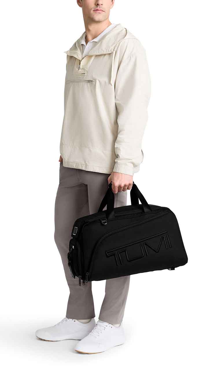 View of man holding the TUMI Golf Duffel