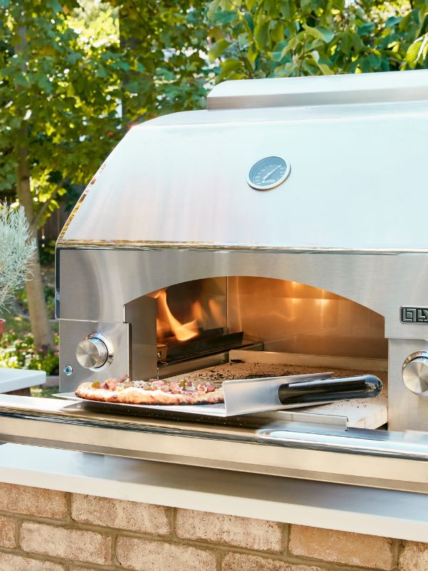 Close up detail shot of the lynx pizza oven with pizza coming out of the oven