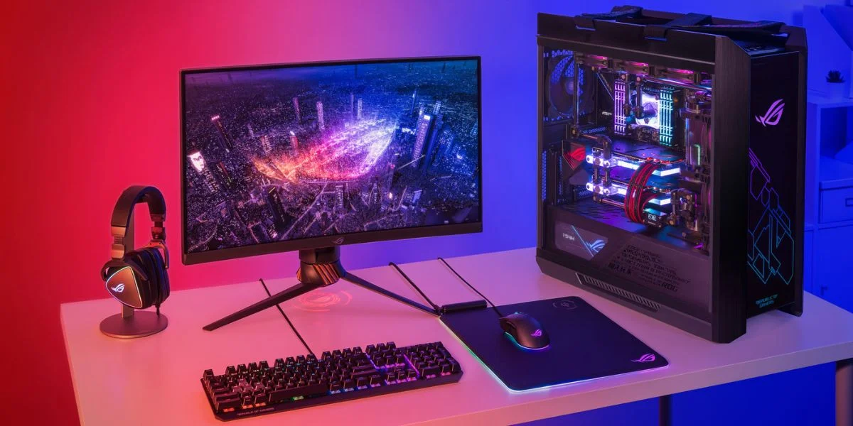 A gaming PC desktop, monitor, dedicated mouse, mousepad and keyboard, all with RGB lighting, beside a headset and stand.