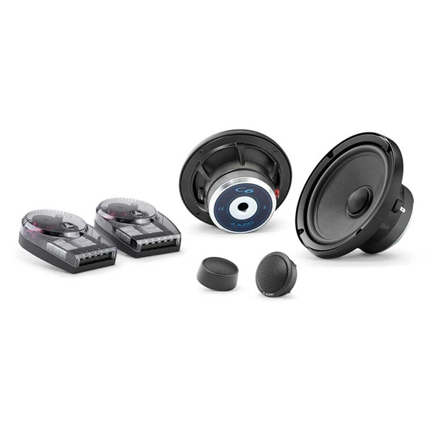 A pair of JL Component speakers against a white background