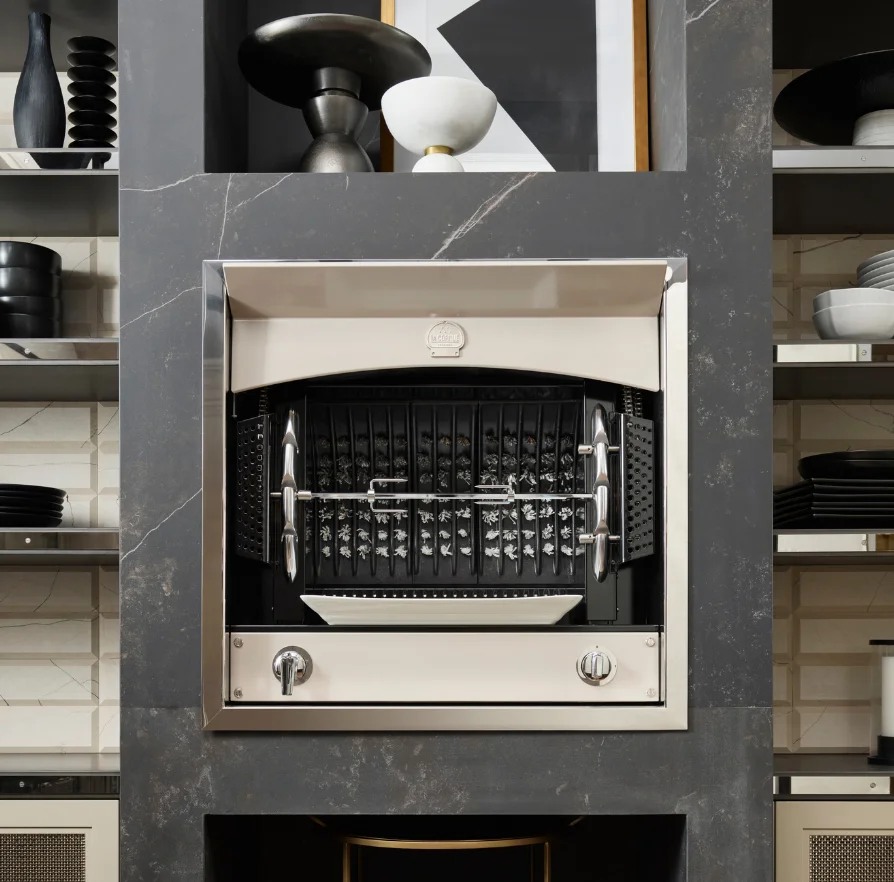 Ivory La Cornue Flamberge rotisserie with rotisserie skewers, built into a stone surround
