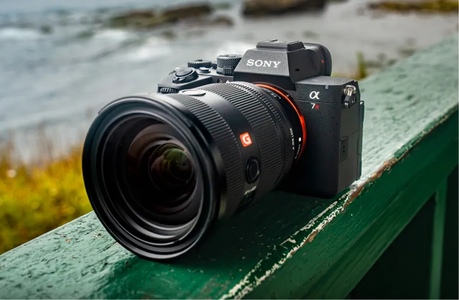 Camera lens on a green outdoor surface