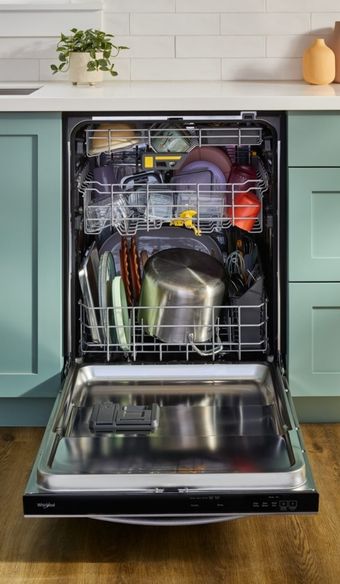 tight shot of a whirlpool dishwasher open showcasing its high capacity
