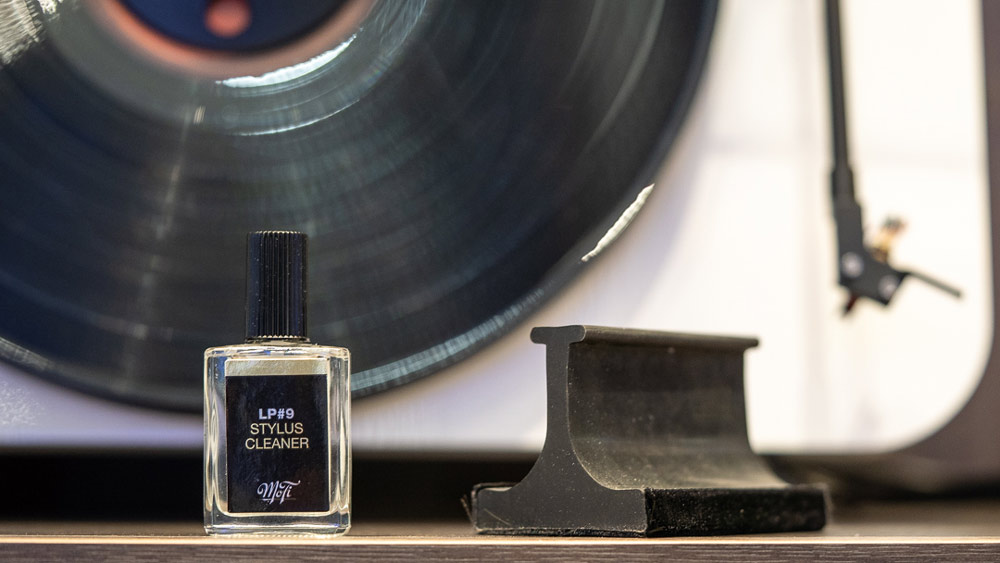 Person cleaning a record