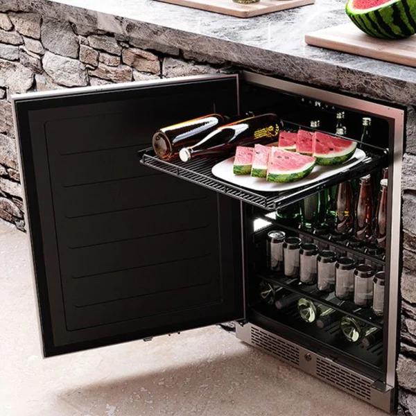 An outdoor refrigerator opened to show various cans, bottles and fruit slices.