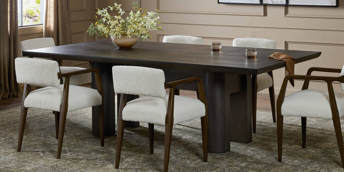 walnut wood dining table with boucle dining chairs