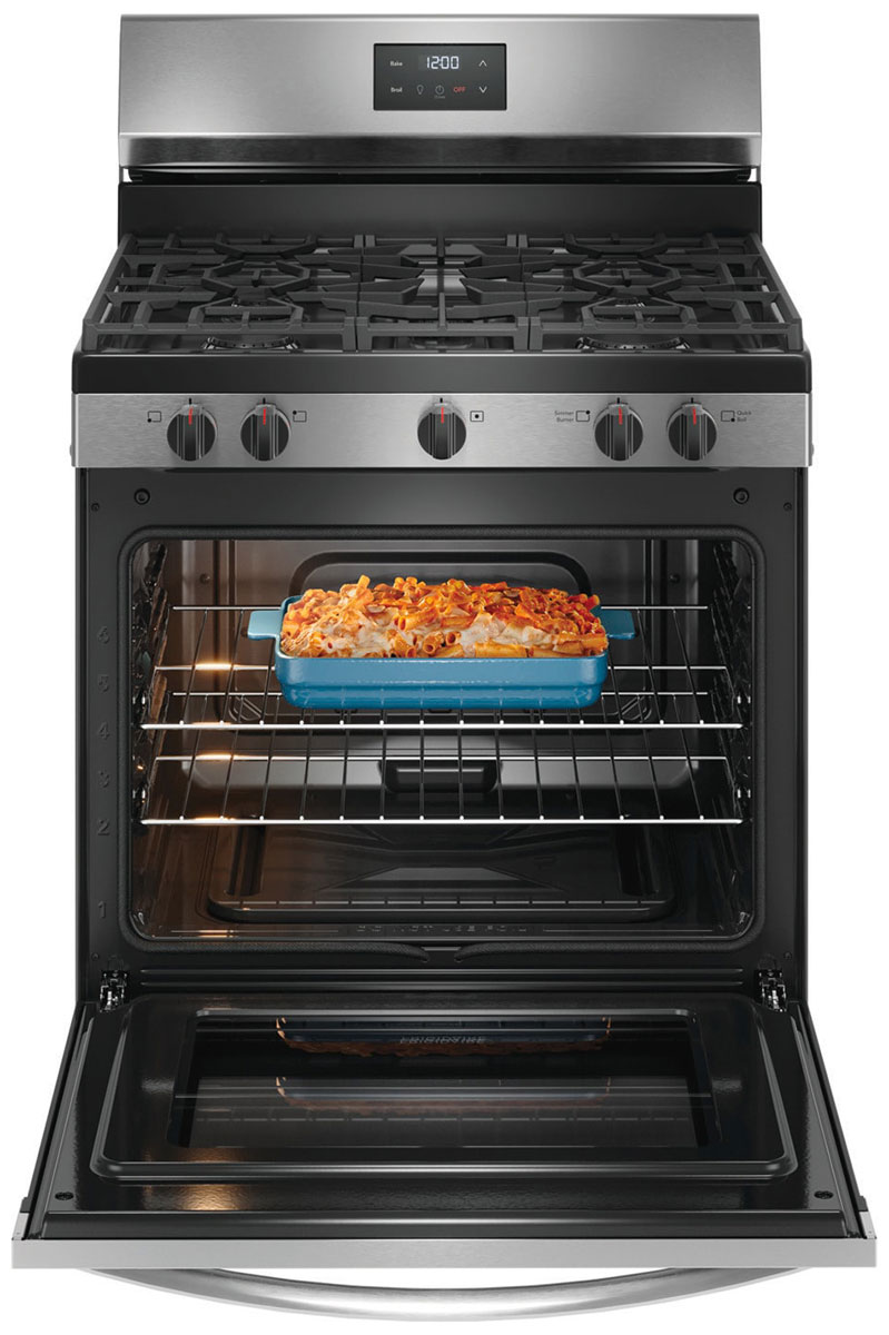Open oven door with a casserole cooking inside.