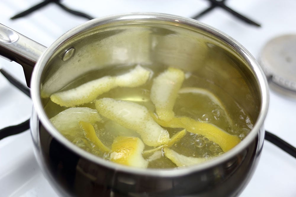 Pot with boiling lemons