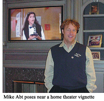 Mike Abt poses near a home theater vignette