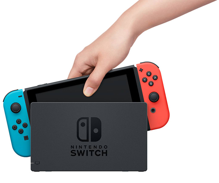 View of Nintendo Switch being placed in console