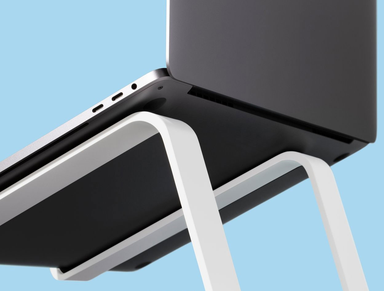 Bottom angled image of Twelve South White Curve Laptop Stand with MacBook