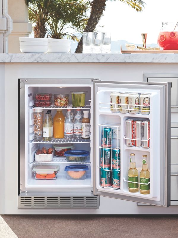 Close up of the undercounter outdoor refrigerator in an outdoor kitchen