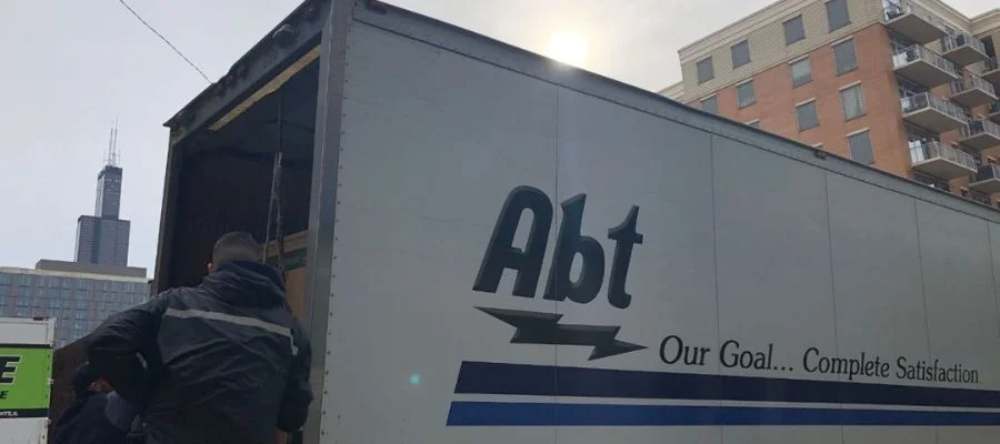 An Abt Truck being unloaded in Chicago. The Willis Tower can be seen in the background.