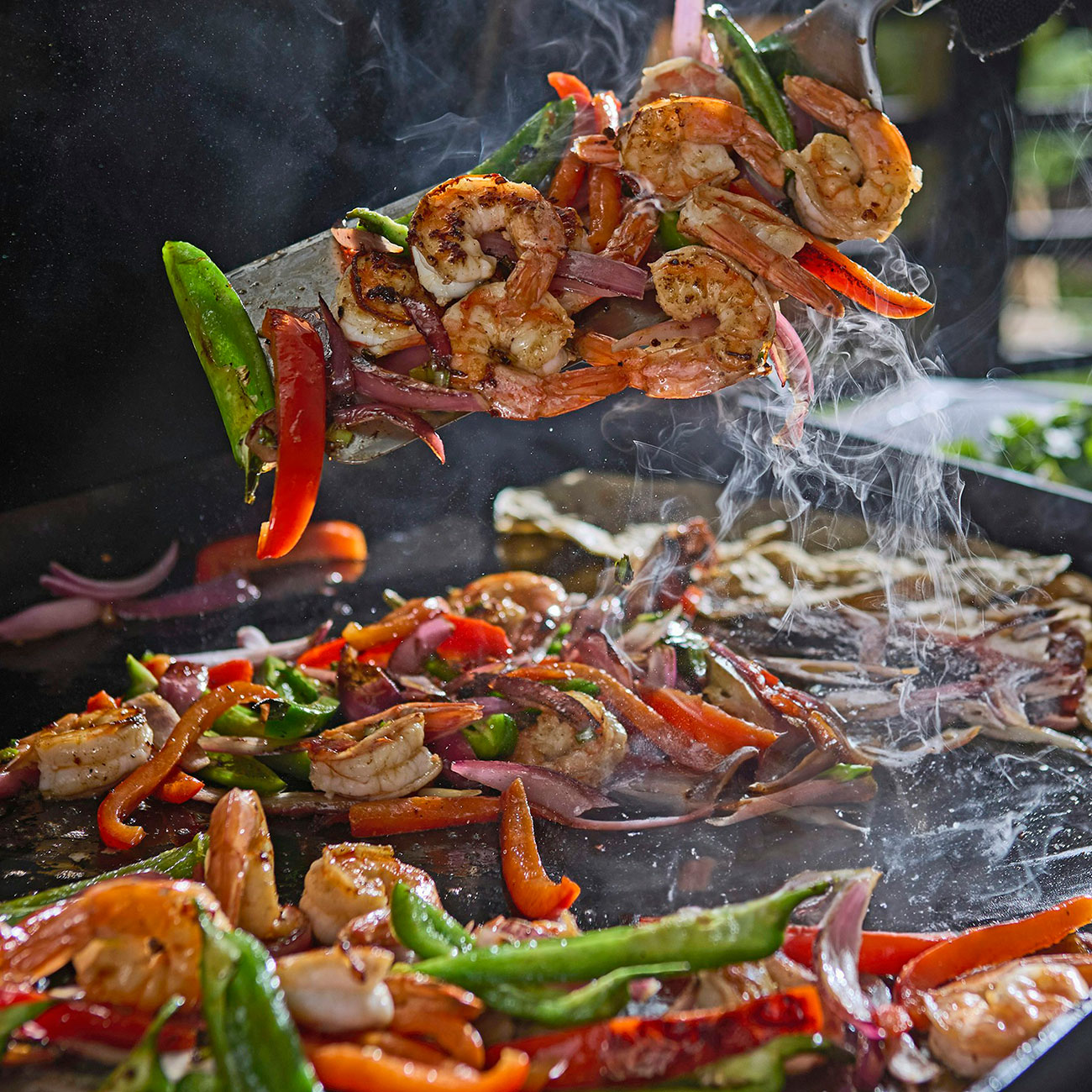 Angled view of food cooked on Weber Liquid Propane Griddle