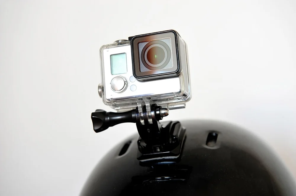 Action camera mounted on helmet