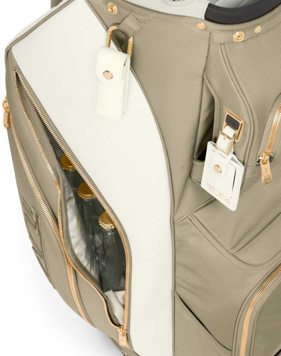 Close up view of TUMI off white and tan golf bag side
