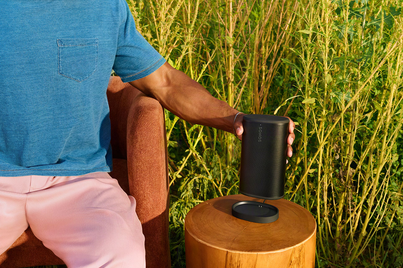 Person Using Sonos Wireless Speaker Outdoors