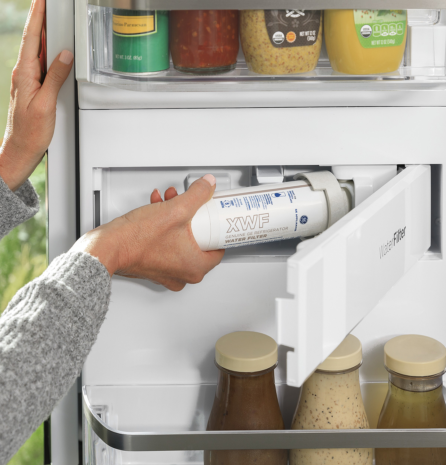 Water filter being installed or removed.