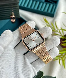 person with gloves on showcasing a watch