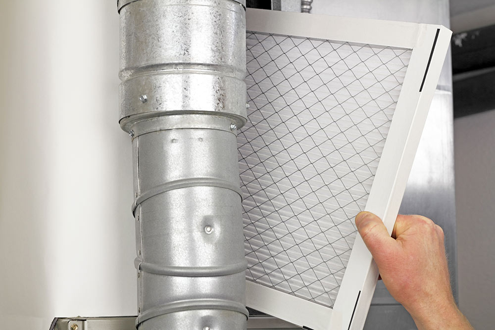 Person replacing air filters