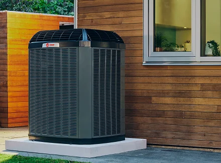 A new HVAC unit being installed outside a home