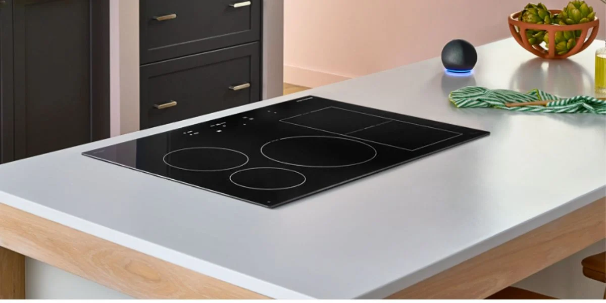 An induction cooktop installed on a kitchen island.