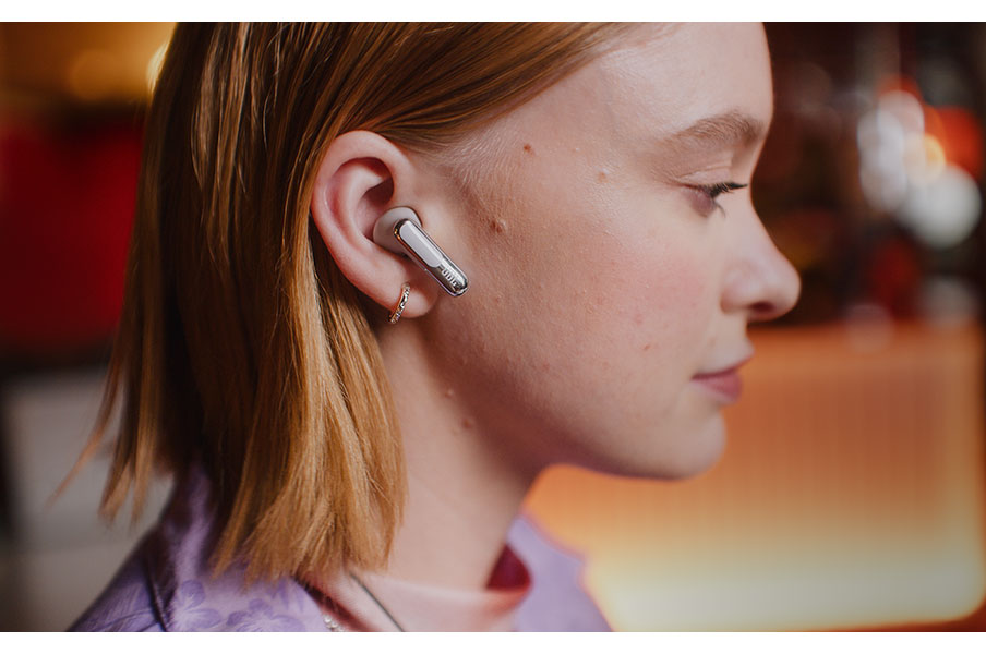 Person Wearing JBL Earbuds