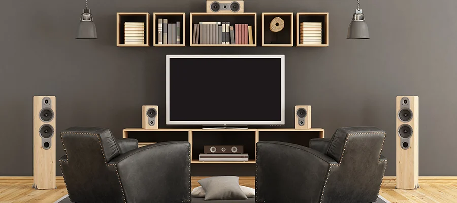 A living room doubling as a home theater. The photo includes electronic products like a TV and speakers, two categories that will be on sale for Abt Days.