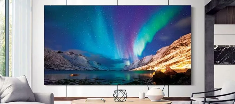 Samsung The Wall showcasing photos of the aurora borealis in a living room with long curtains in front of the window