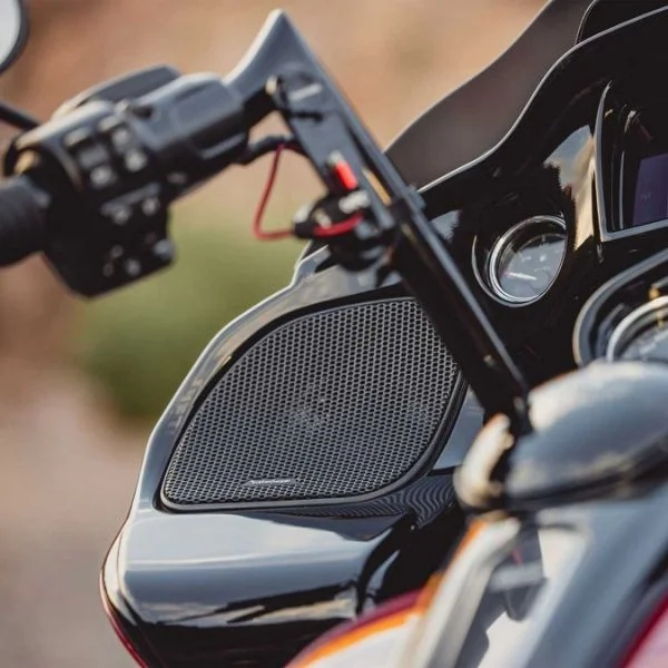 A lifestyle image of a motorcycle speaker on a classic motorcycle